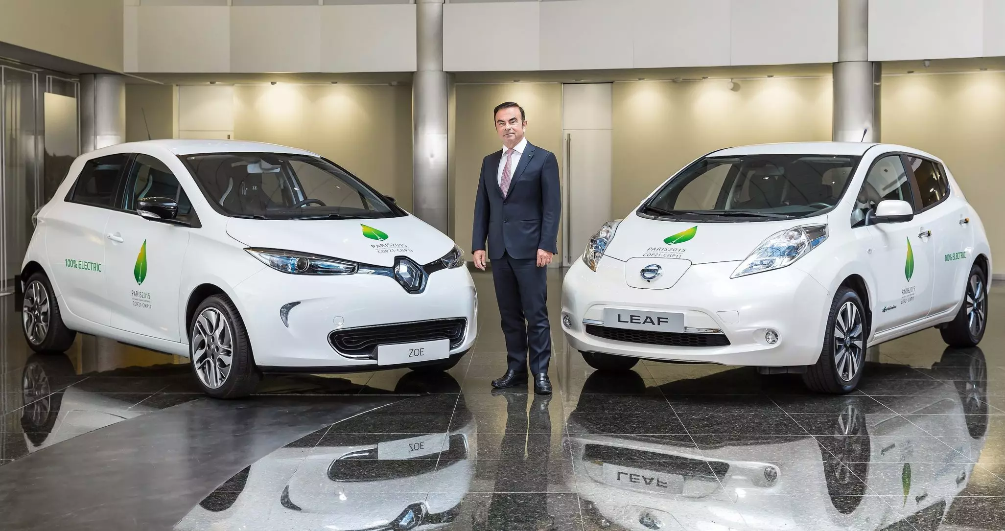 Carlos Ghosn with Renault Zoe and Nissan Leaf