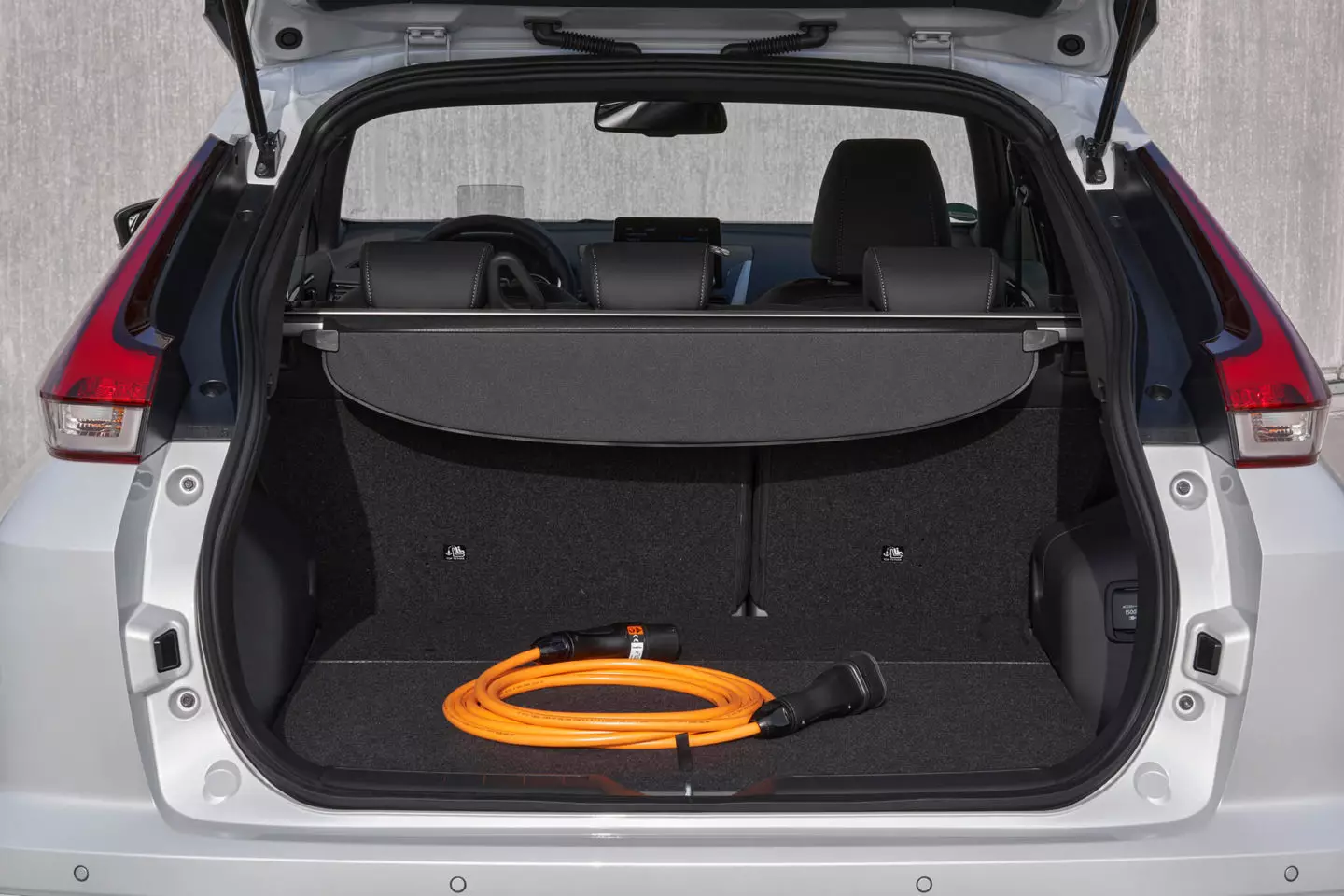 Luggage compartment with charging cable